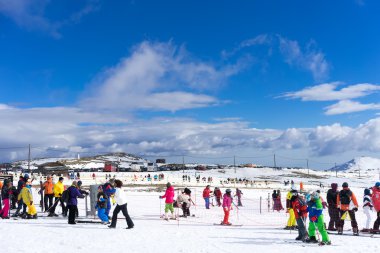 Skiers enjoy the snow at Kaimaktsalan ski center, in Greece. Rec clipart
