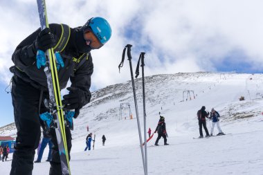 Skiers enjoy the snow at Kaimaktsalan ski center, in Greece. Rec clipart