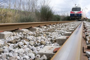 Derailed train coaches at the site of a train accident at the Ge clipart