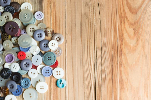 Colored buttons on wooden board, Colorful buttons, on old wooden — Stock Photo, Image