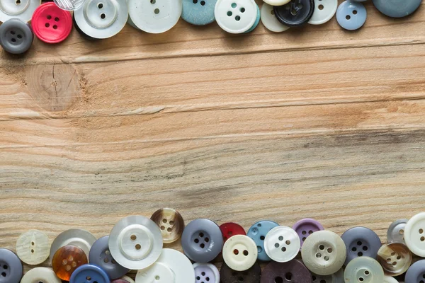 Colored buttons on wooden board, Colorful buttons, on old wooden — Stock Photo, Image