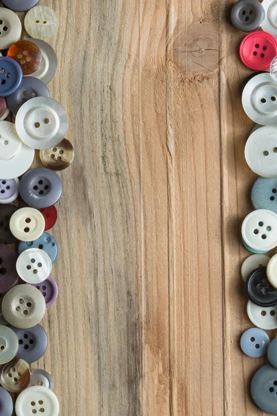 Colored buttons on wooden board, Colorful buttons, on old wooden — Stock Photo, Image