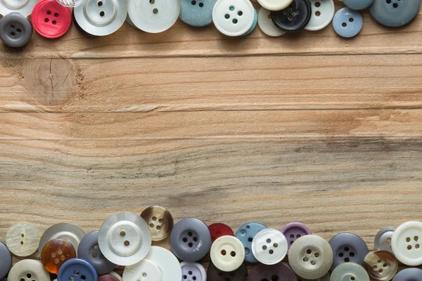 Colored buttons on wooden board, Colorful buttons, on old wooden — Stock Photo, Image