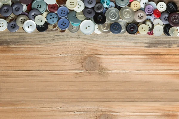 Colored buttons on wooden board, Colorful buttons, on old wooden — Stock Photo, Image