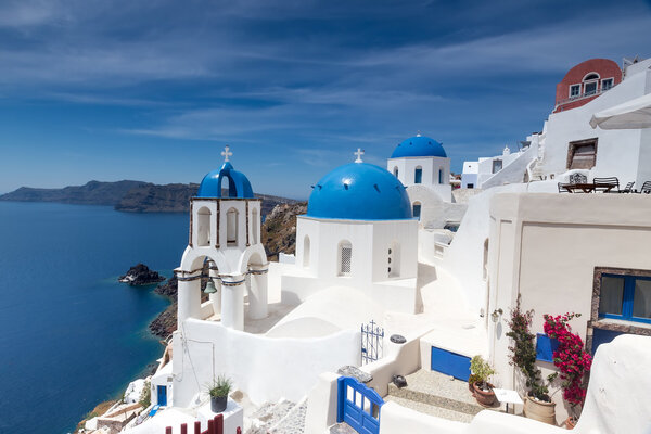 Blue and white church of Oia village on Santorini island. Greece