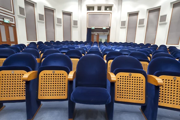 Empty blue seats for cinema, theater, conference or concert. The — Stock Photo, Image