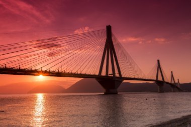 View of the bridge Rio-Antirio in Greece, at sunset. clipart