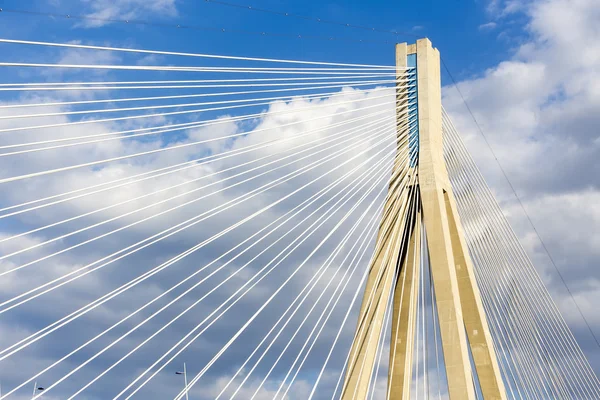 Cables and supports of bridge Rio-Antirio in Greece against blue