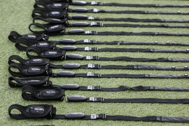 Soccer (football) training equipment on the green field of the