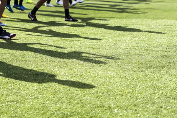 The feet of the players of Paok with their shadows during team p — Zdjęcie stockowe