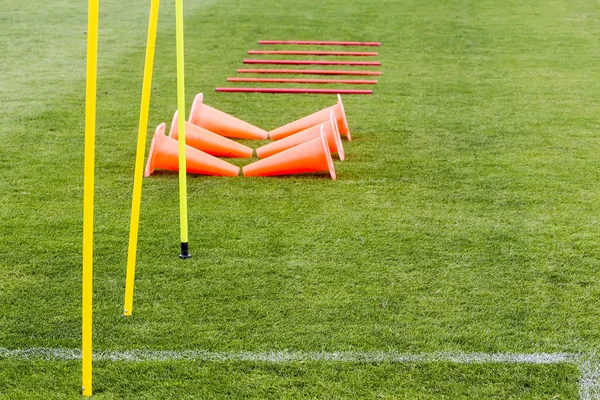 Soccer (football) training equipment on the green field of the s — Stock Photo, Image