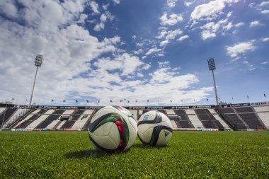 Balls of Paok team on the field of the stadium during team pract