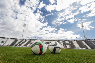 Balls of Paok team on the field of the stadium during team pract