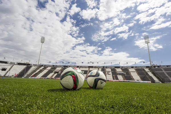 Balls of Paok team on the field of the stadium during team pract — Stok fotoğraf
