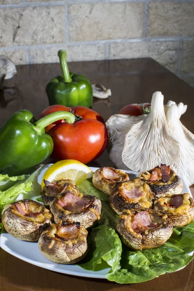 Baked mushroom caps stuffed with sausage, cheese, and spices. — Stock Photo, Image