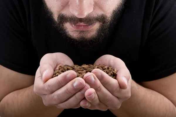 Man holding coffee and enjoys the aroma close up — Stock Photo, Image