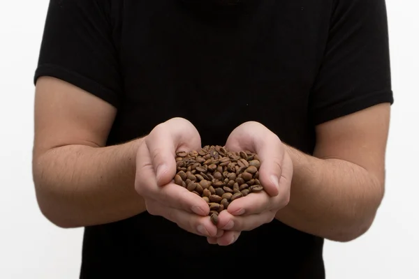 Hands holding coffee making heart form isolated on white backgro — Stock Photo, Image