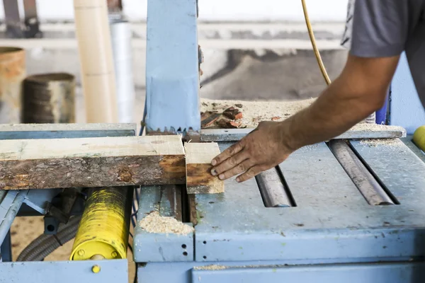 Craftsmen cut a piece of wood at a woodworking factory in Greece — Stock Photo, Image