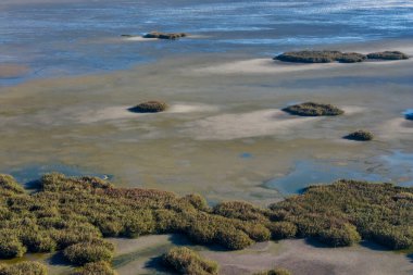 Yunanistan 'ın orta Makedonya kentindeki Koroneia Gölü, açıkta kalan sulak alanları ve azalan su kaynaklı endişe verici kuraklık ve iklim değişikliği işaretlerini ortaya çıkardı