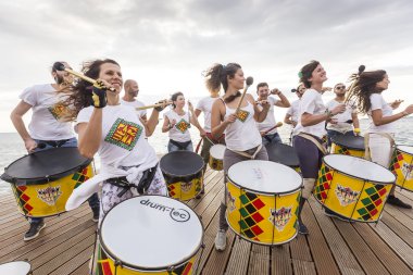 Drummers and musicians during  outdoor fashion show with clothin clipart