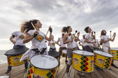 Drummers and musicians during  outdoor fashion show with clothin