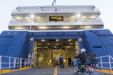 View of passengers getting in the ferry boat at the harbor, in N