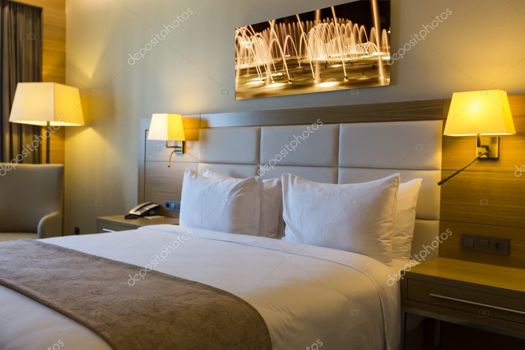 Beautiful hotel room with framed photo on the wall — Stock Photo © vverve # 86868548