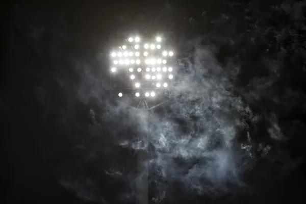 stadium lights and smoke