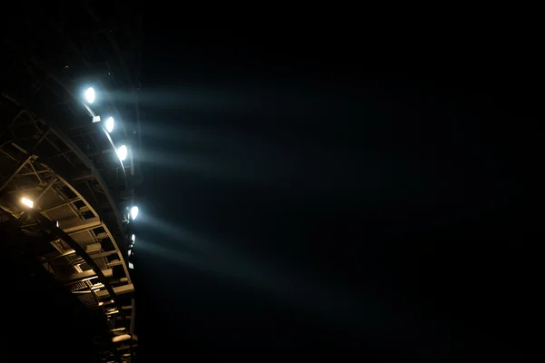 Bright white and yellow Stadium lights with fog — Stock Photo, Image