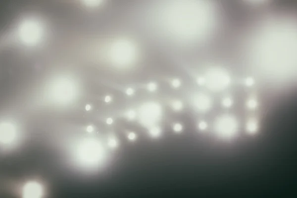 Bright white and yellow Stadium lights with fog. Defocused image — Stock Photo, Image