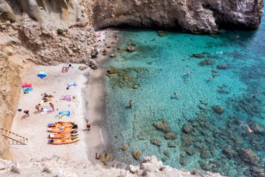 Top view of canoes at Tsigrado Beach in Milos island, Cyclades,  clipart