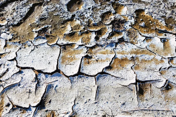 Cama de lago seco com textura natural de argila rachada em perspectiva — Fotografia de Stock