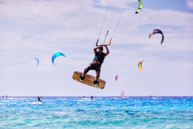 Kitesurfers on the Milos beach in Lefkada, Greece clipart