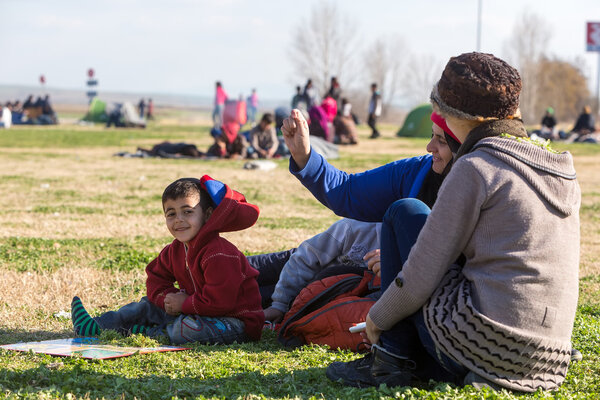 Thousands migrants and refugees are waiting in the parking lot o