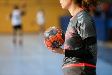 Undefined hands holding a ball prior to the Greek Women Cup Fina