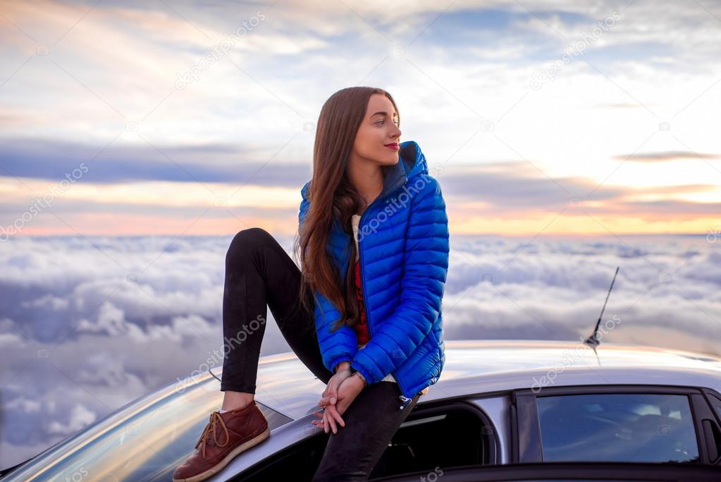 Woman enjoying beautiful cloudscape