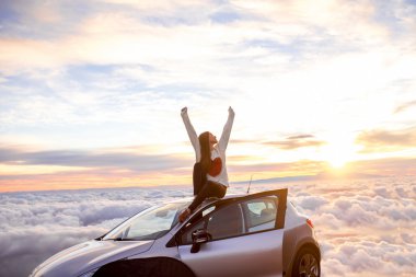 Woman enjoying beautiful cloudscape