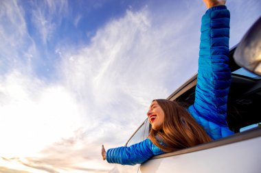 Woman enjoying beautiful cloudscape