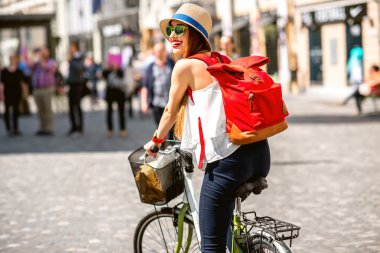 Woman riding a bicycle in the old european city