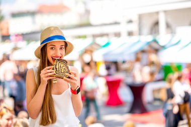 Woman eating traditional slovenian dessert