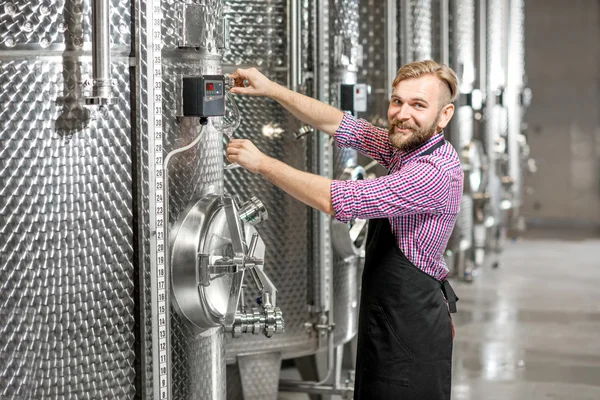 Wine maker at the manufacture — Stock Photo, Image