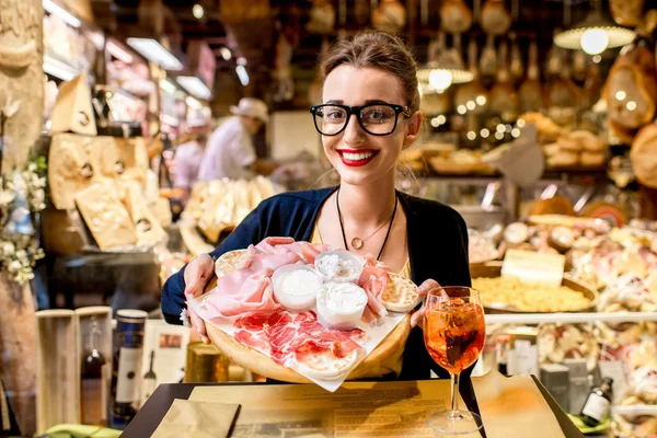 Woman with traditional italian appetizer