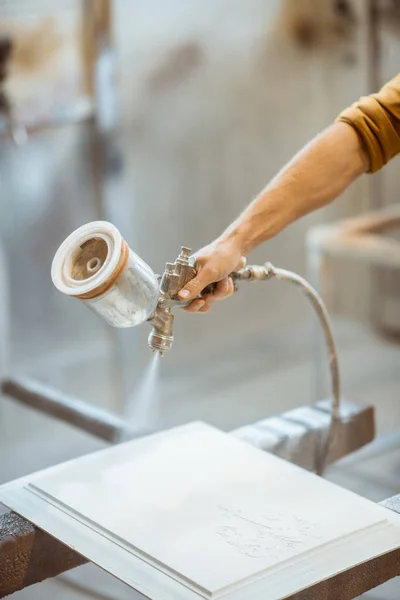 Painting wooden product with a spray gun — Stock Photo, Image