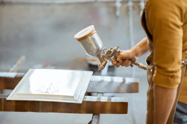 Painting wooden product with a spray gun — Stock Photo, Image