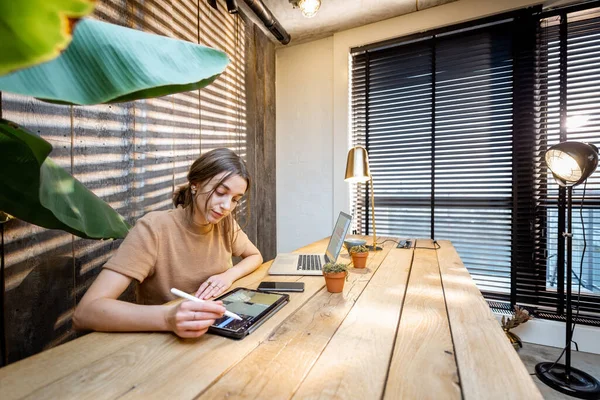 Creative woman with digital tablet at home office — Stock Photo, Image