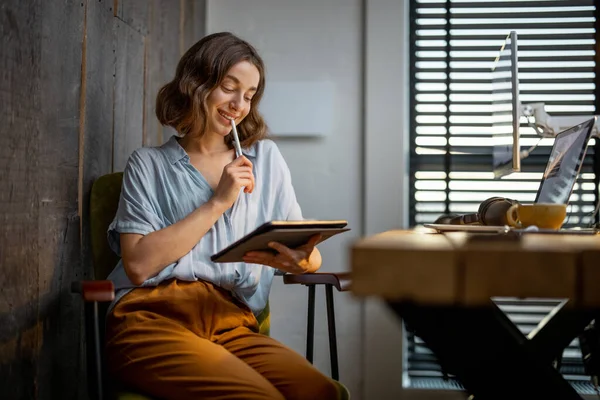 Creative woman with a digital tablet at home office — Stock Photo, Image