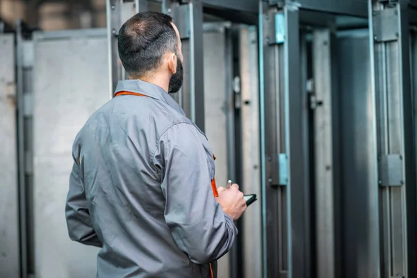 Worker with a digital tablet at the plant — Stock Photo, Image