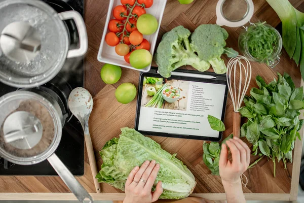 Recipe of healthy salad on digital tablet