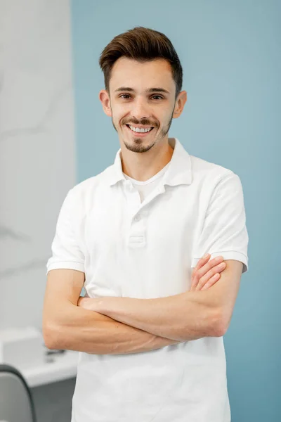 Portrait of a young dentist in cabinet — Stock Photo, Image