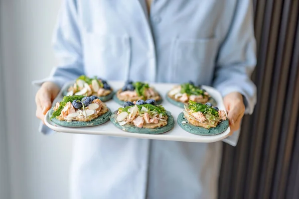 Homemade tasty appetizer on a blue pancakes. — Stok fotoğraf